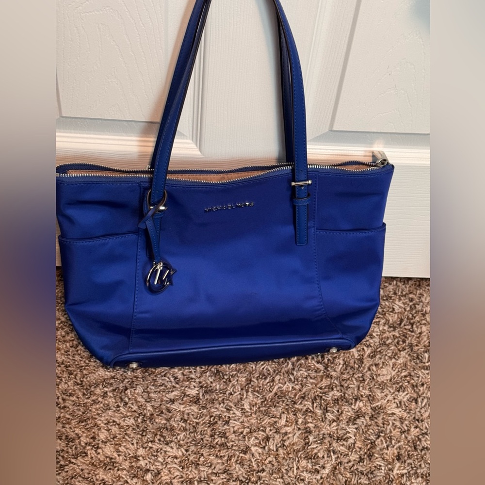 Michael Kors royal blue tote with silver detail.